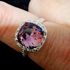 Beautiful silver colored ring with bling! Shiny square cut purple gem
